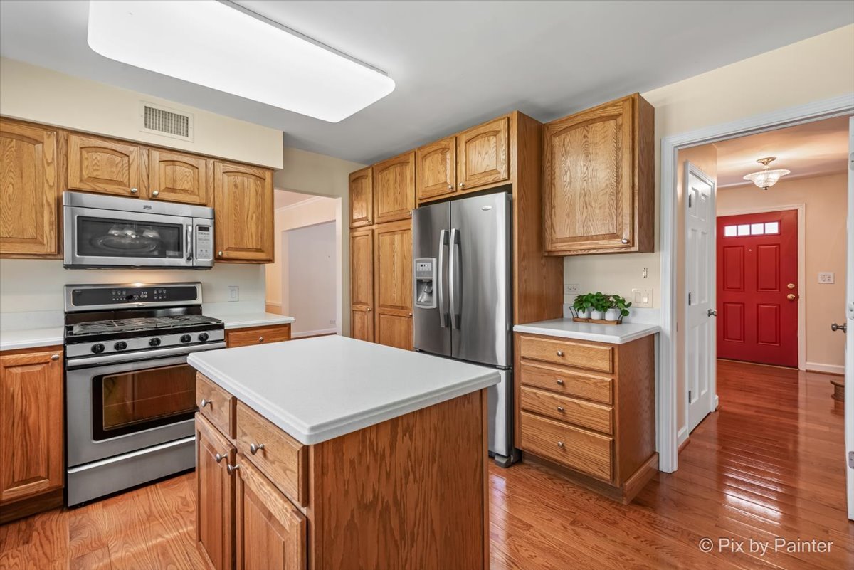 1599 Burning Trail Wheaton, IL 60189 - Photo 20 of 64 a kitchen with a refrigerator stove and sink