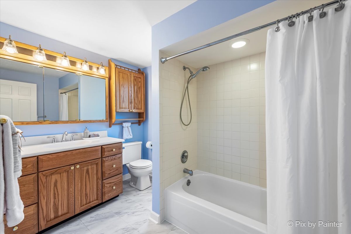 1599 Burning Trail Wheaton, IL 60189 - Photo 36 of 64 a bathroom with a double vanity sink toilet mirror and bathtub