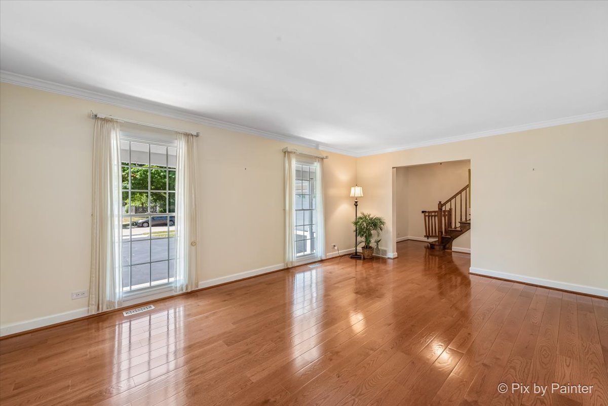 1599 Burning Trail Wheaton, IL 60189 - Photo 5 of 64 a view of empty room with wooden floor and fan