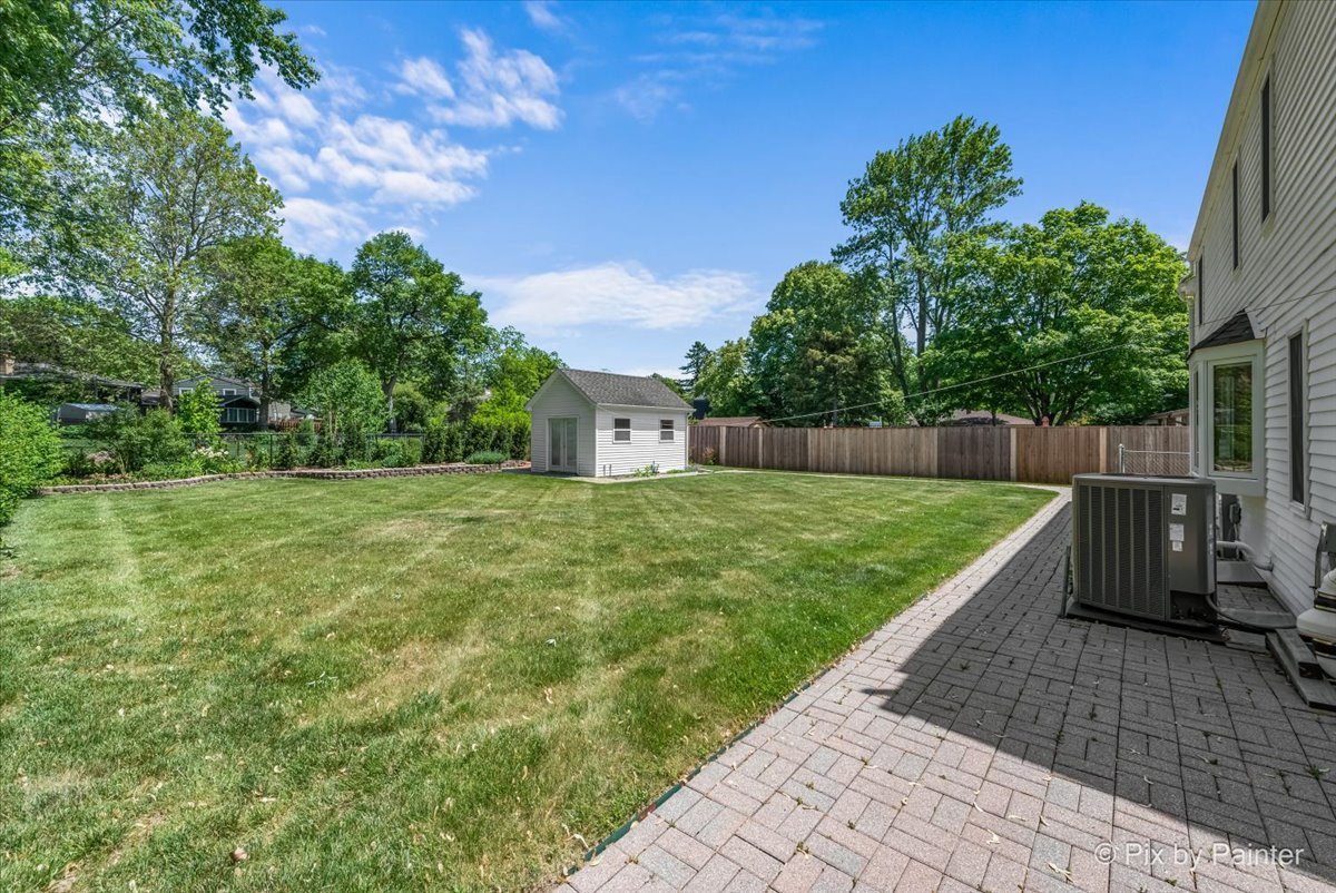 1599 Burning Trail Wheaton, IL 60189 - Photo 56 of 64 a view of a backyard with large trees