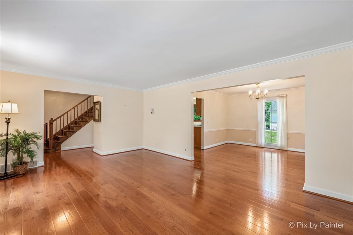 1599 Burning Trail Wheaton, IL 60189 - Photo 6 of 64 a view of an empty room with wooden floor and stairs