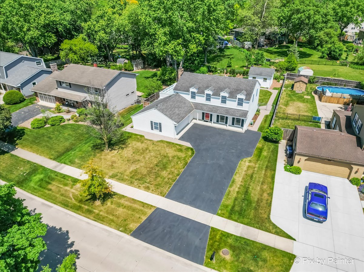 1599 Burning Trail Wheaton, IL 60189 - Photo 62 of 64 an aerial view of a house with a garden and pool