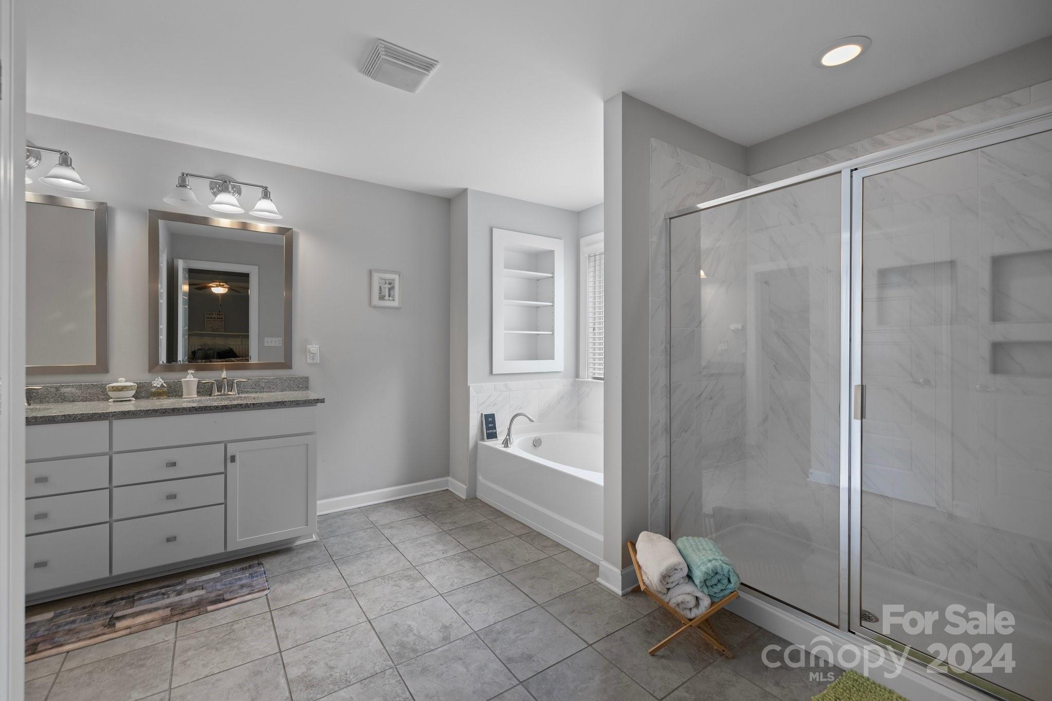 2061 Fuschia Court Fort Mill, SC 29708 - Photo 19 of 45 a bathroom with a granite countertop sink a toilet and shower