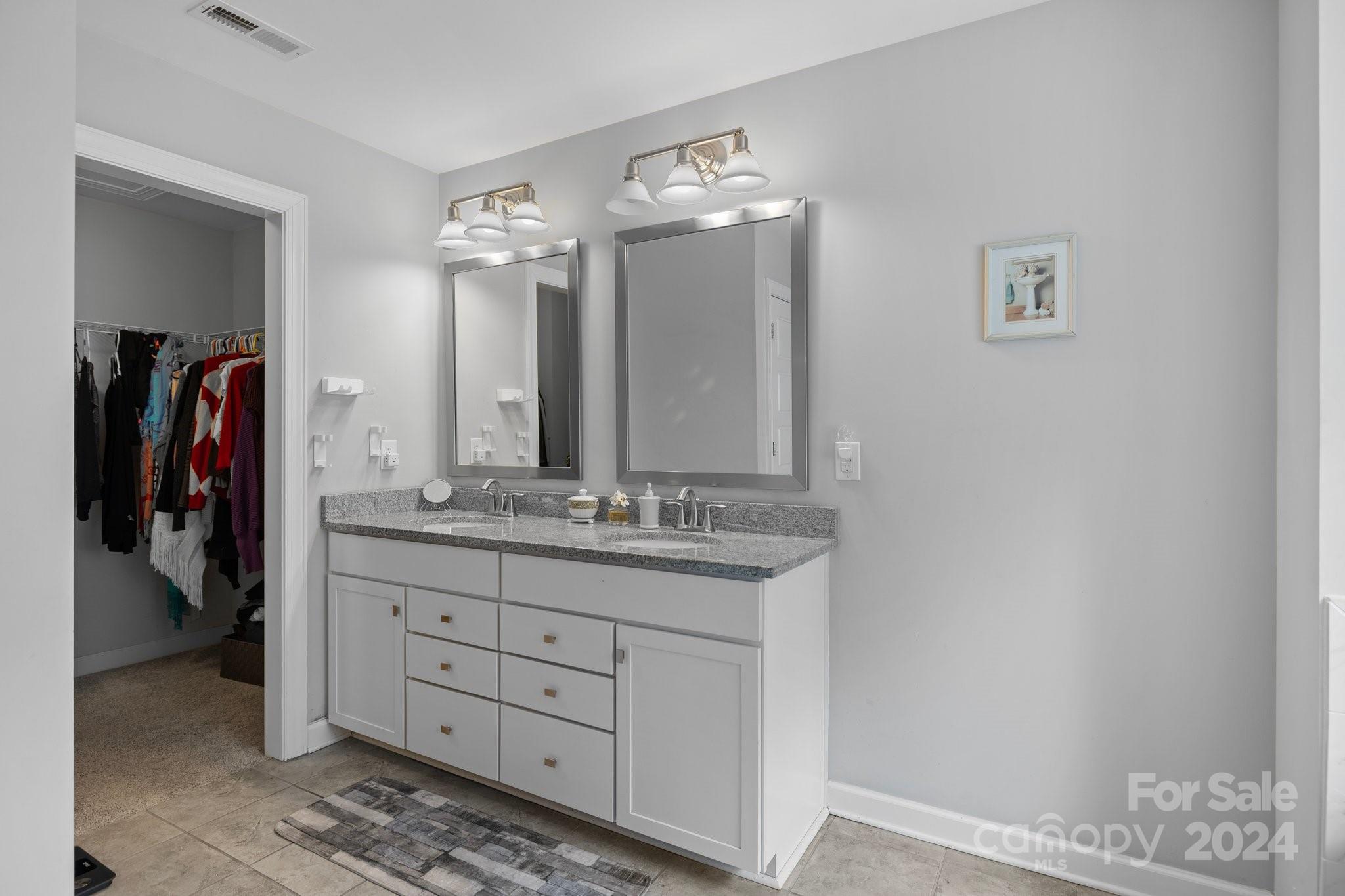 2061 Fuschia Court Fort Mill, SC 29708 - Photo 20 of 45 a bathroom with a double vanity sink and a mirror
