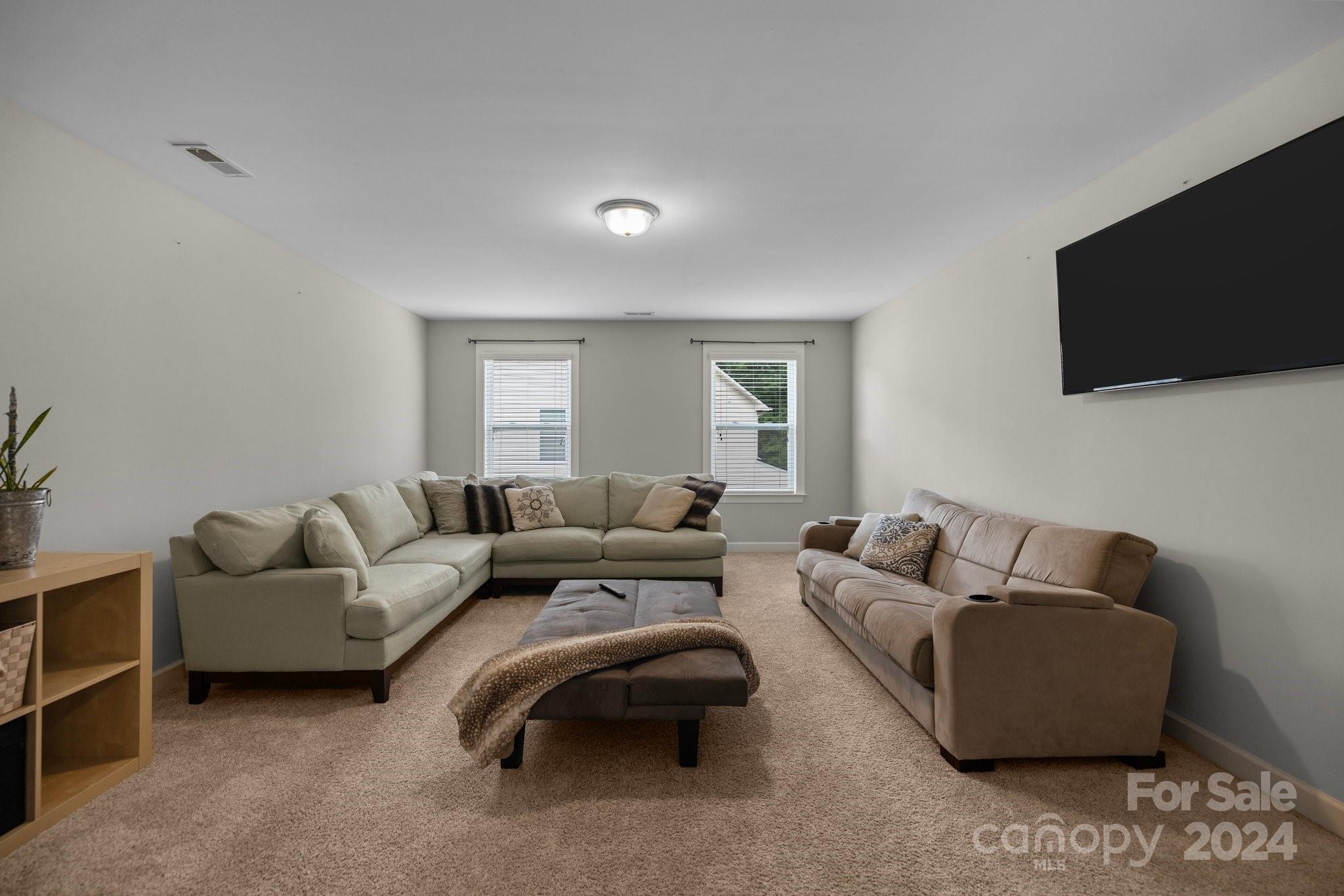 2061 Fuschia Court Fort Mill, SC 29708 - Photo 21 of 45 a living room with furniture and a flat screen tv