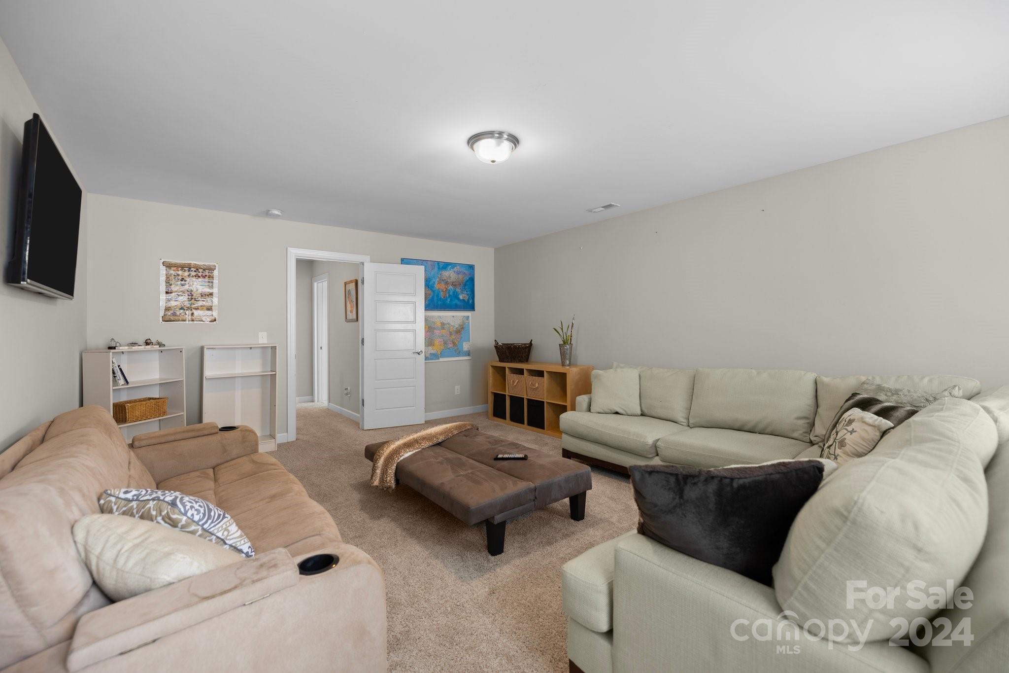 2061 Fuschia Court Fort Mill, SC 29708 - Photo 22 of 45 a living room with furniture and a flat screen tv