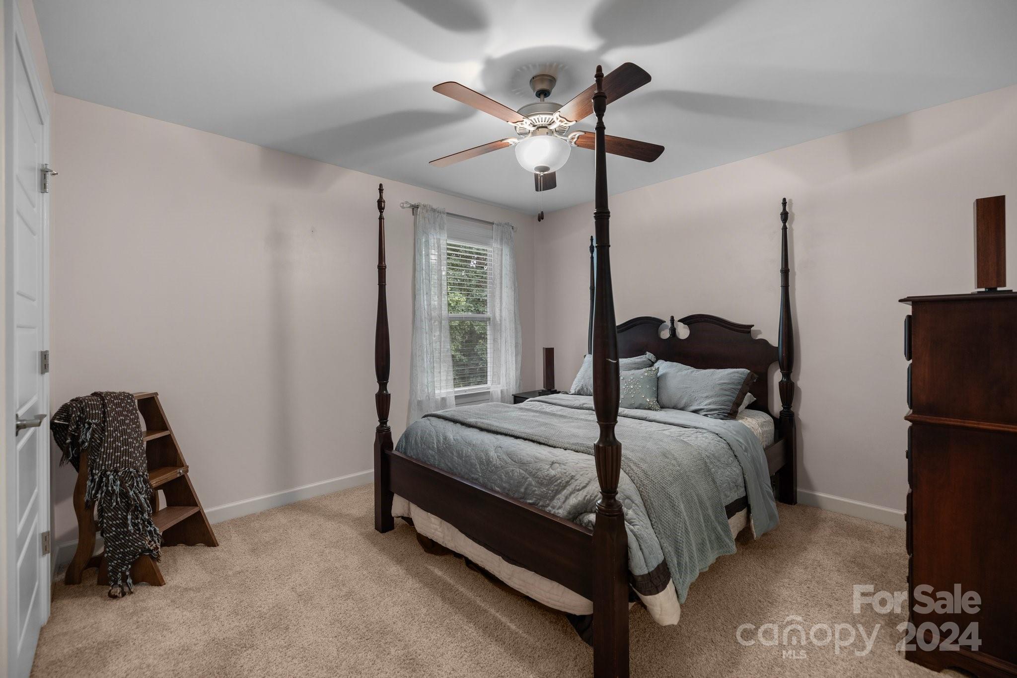 2061 Fuschia Court Fort Mill, SC 29708 - Photo 23 of 45 a bedroom with a bed and a window