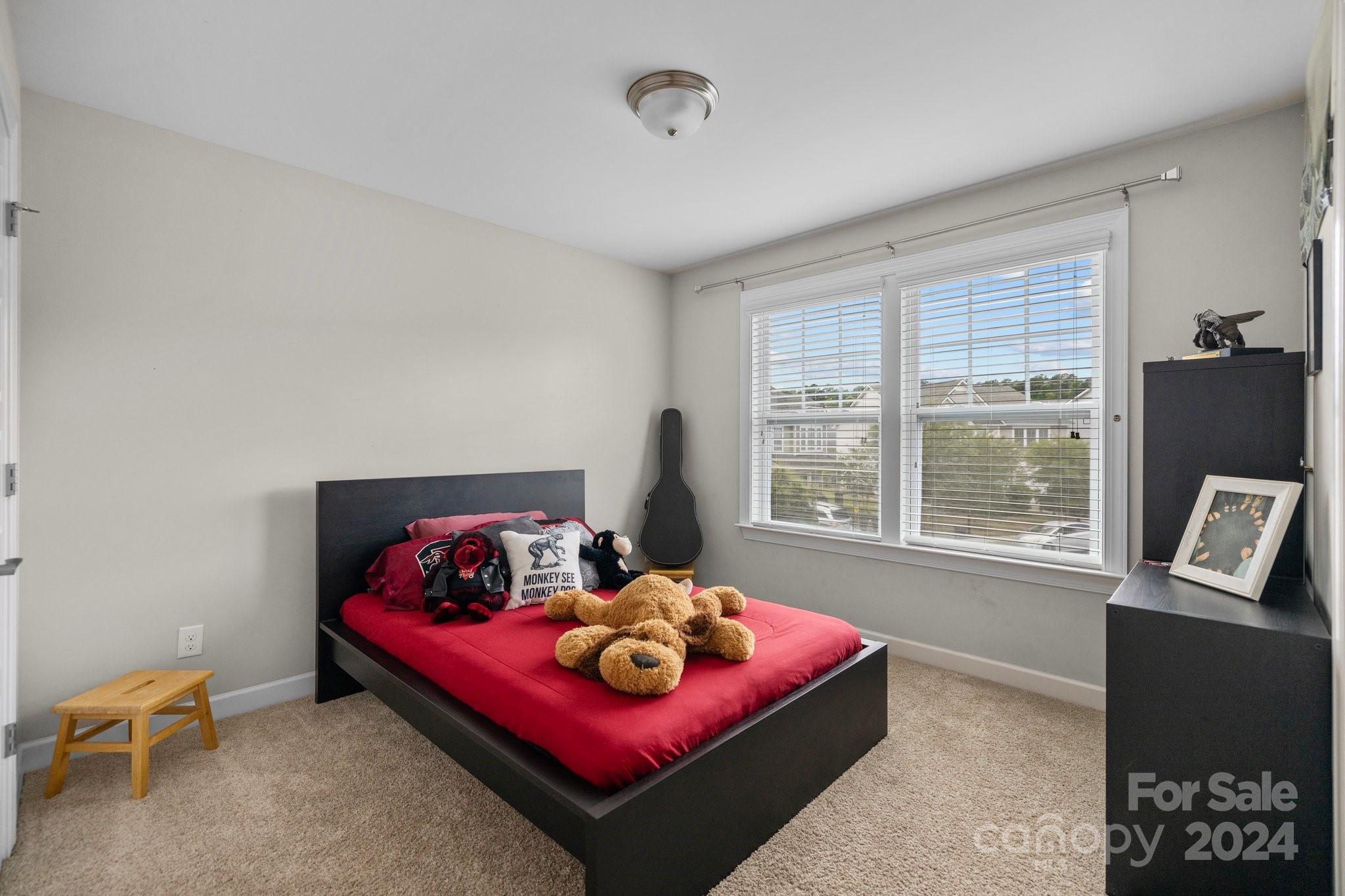 2061 Fuschia Court Fort Mill, SC 29708 - Photo 28 of 45 a bedroom with furniture and a large window