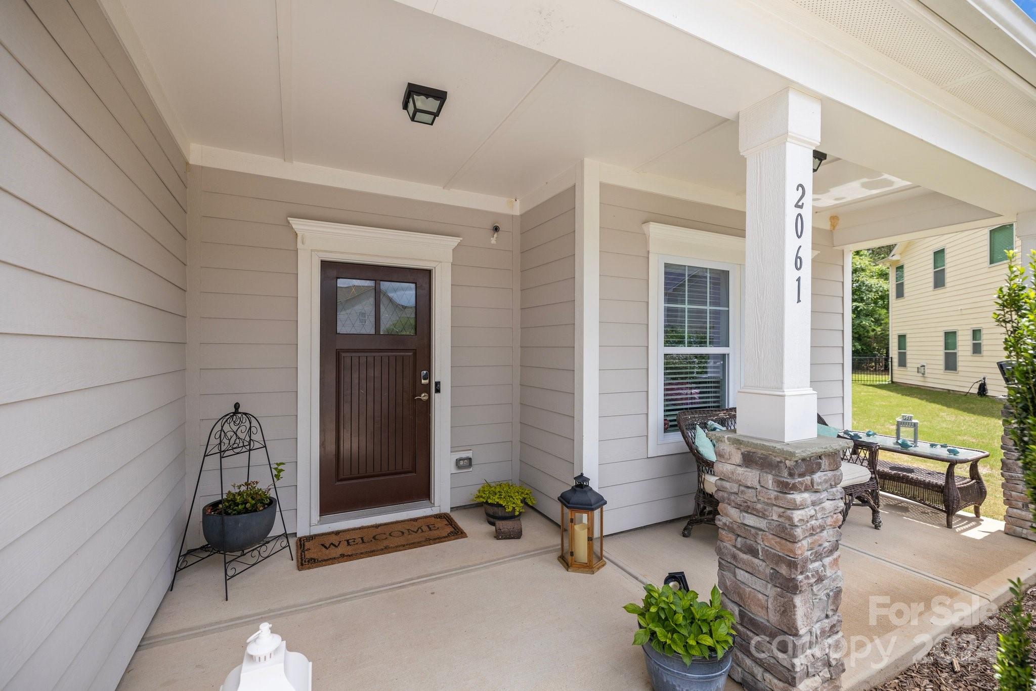 2061 Fuschia Court Fort Mill, SC 29708 - Photo 31 of 45 a building outdoor space with patio furniture and potted plants