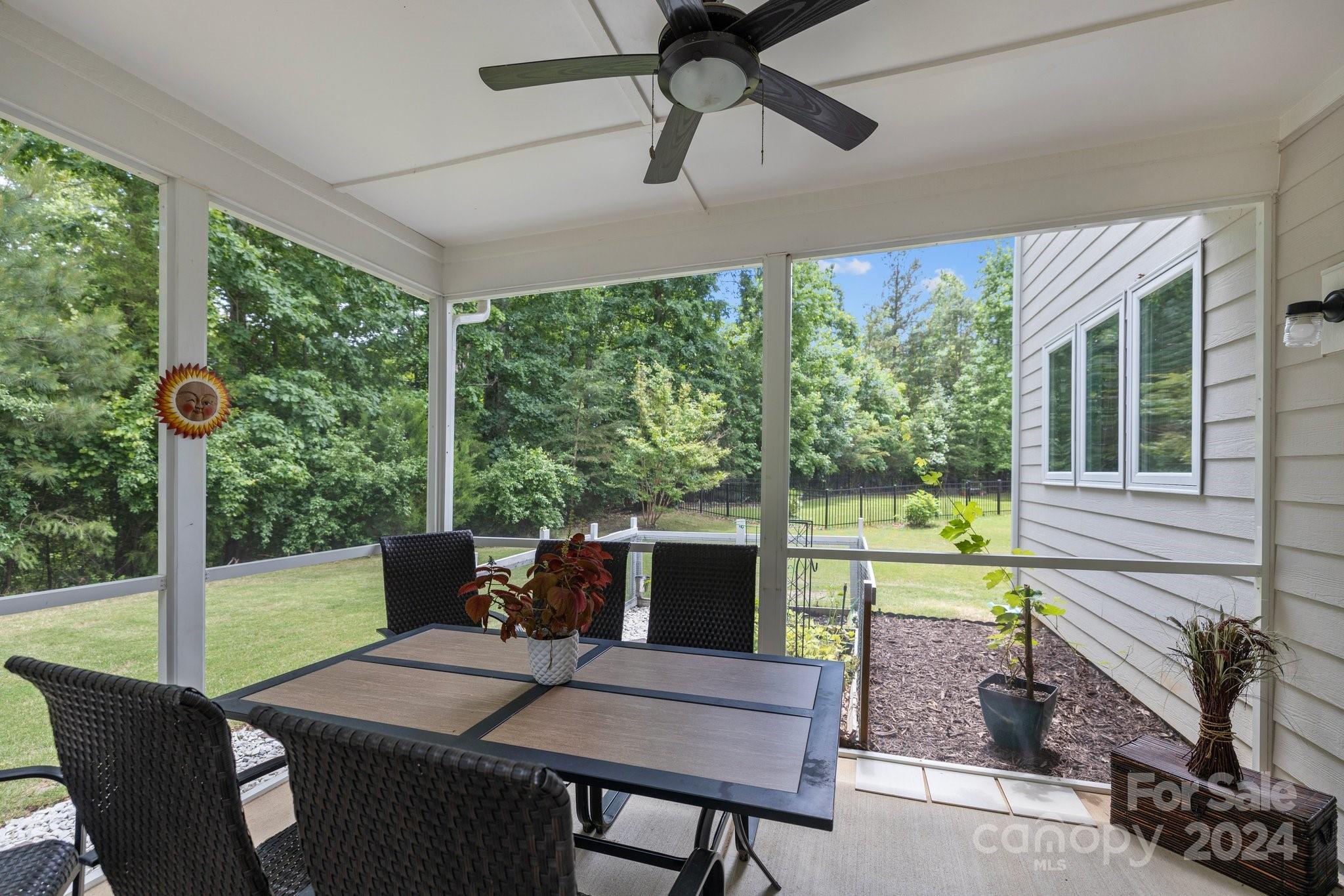 2061 Fuschia Court Fort Mill, SC 29708 - Photo 33 of 45 a view of a patio with a table chairs and a backyard