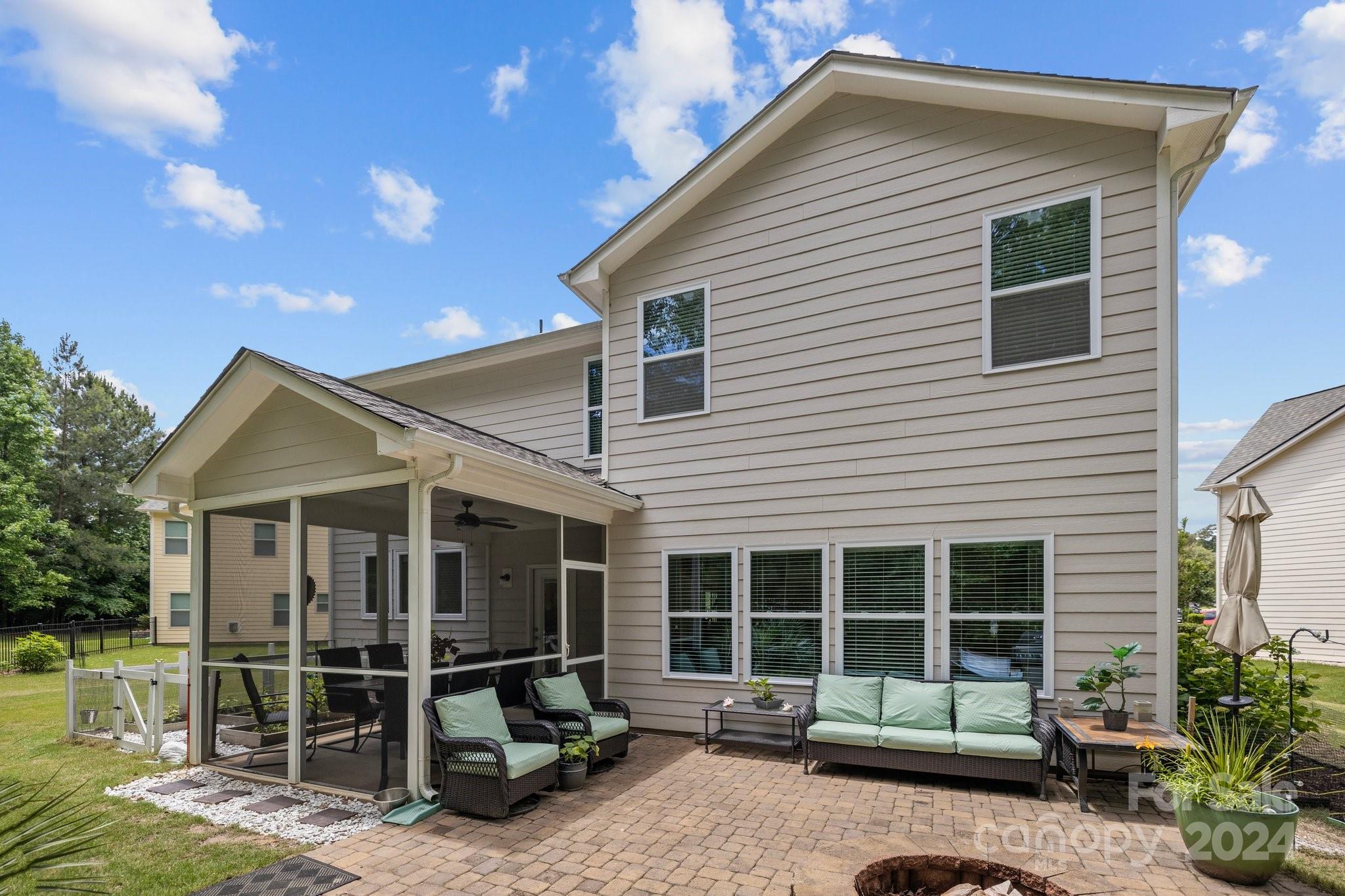 2061 Fuschia Court Fort Mill, SC 29708 - Photo 37 of 45 a view of a house with a patio and a yard