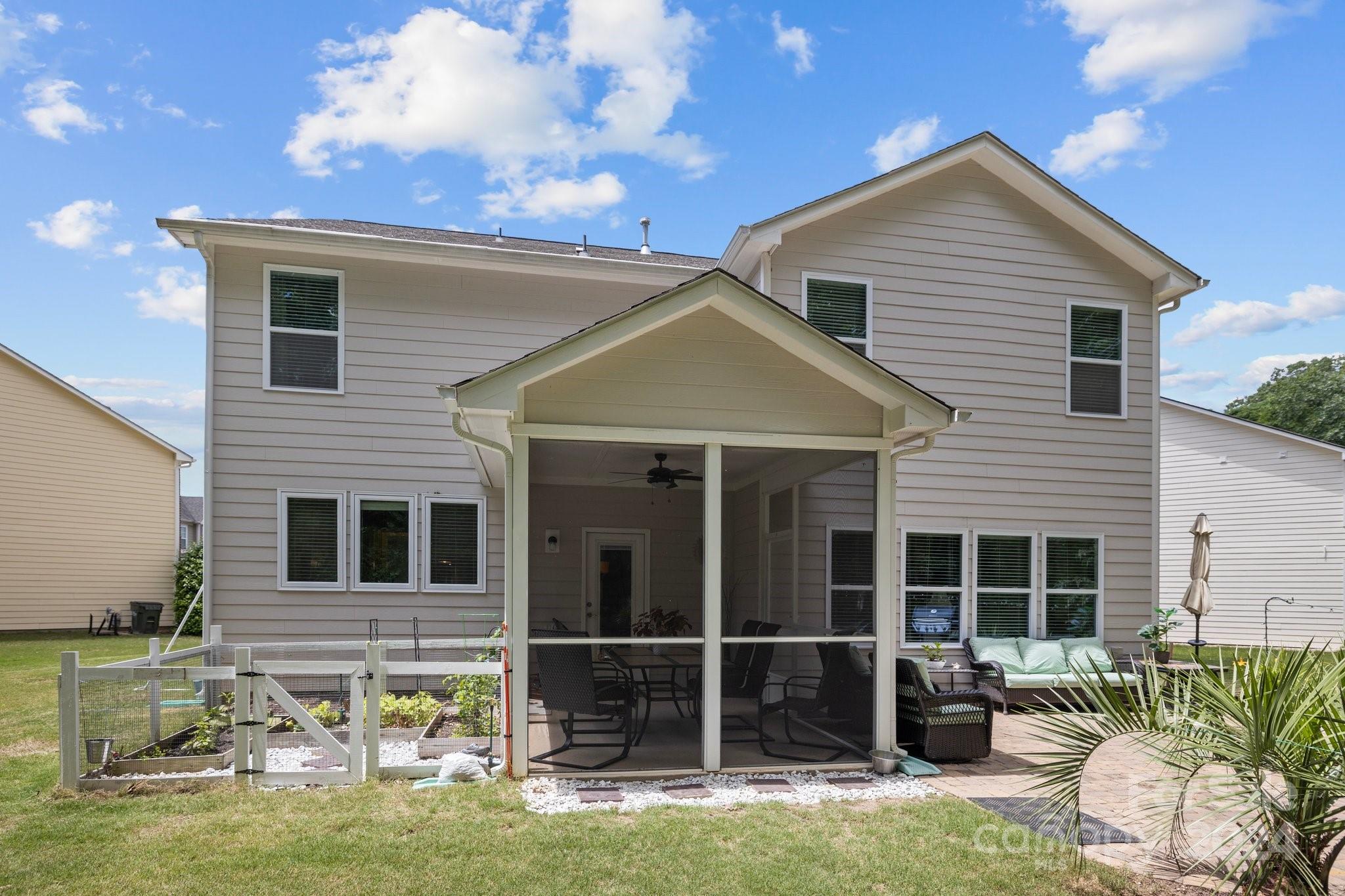2061 Fuschia Court Fort Mill, SC 29708 - Photo 38 of 45 a backyard of a house with table and chairs