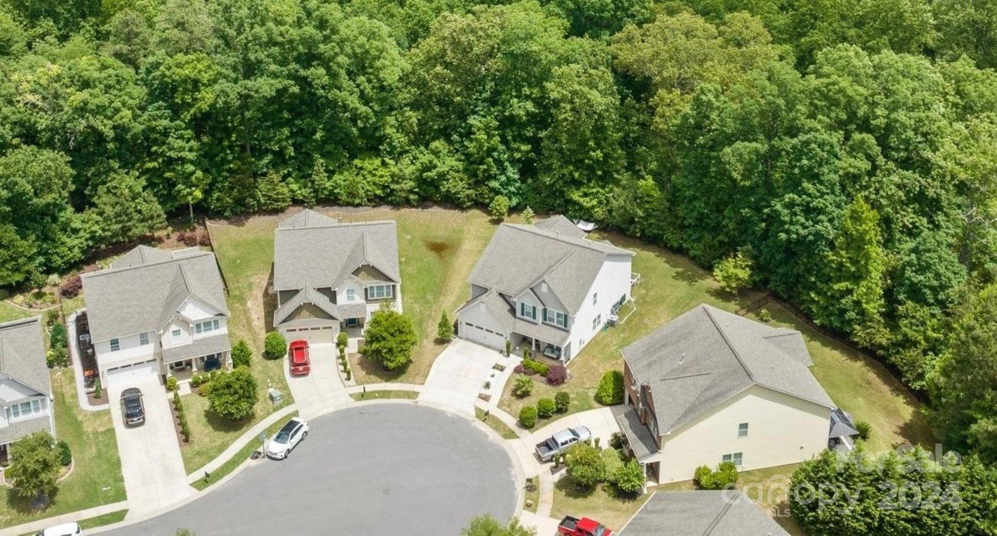2061 Fuschia Court Fort Mill, SC 29708 - Photo 40 of 45 an aerial view of a house with a yard and a large tree