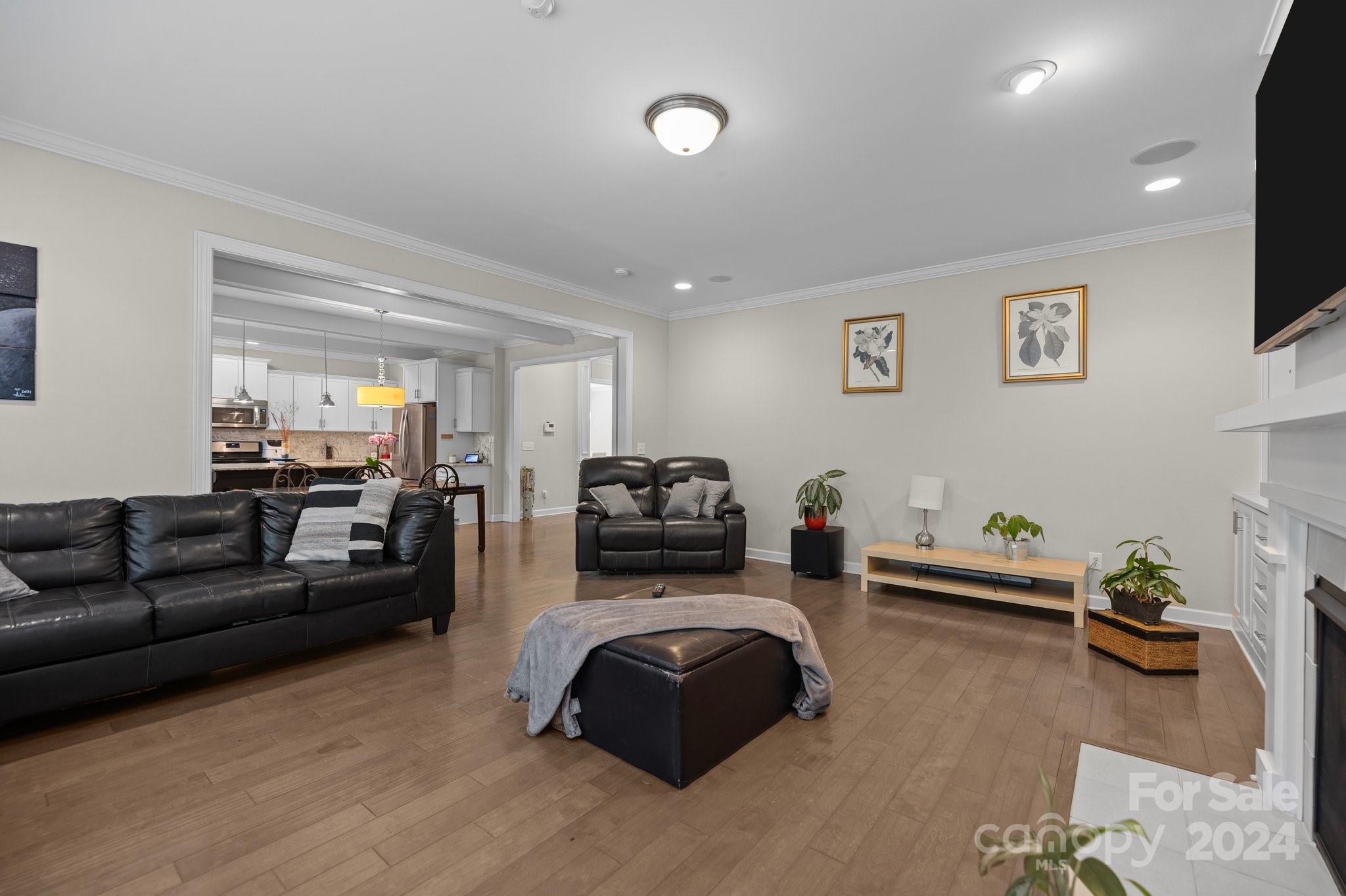 2061 Fuschia Court Fort Mill, SC 29708 - Photo 4 of 45 a living room with furniture and a flat screen tv