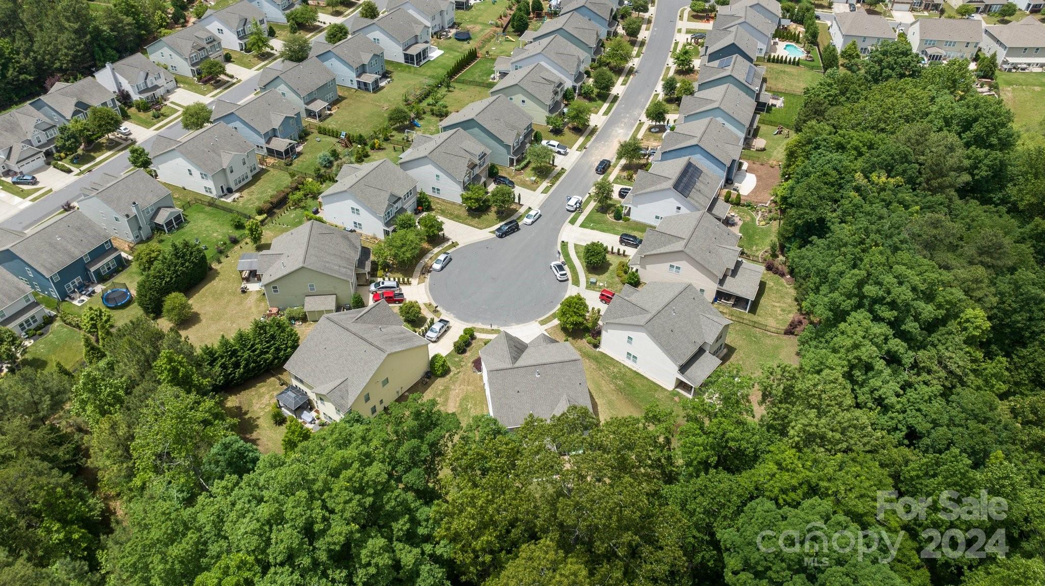 2061 Fuschia Court Fort Mill, SC 29708 - Photo 41 of 45 an aerial view of residential house with outdoor space and trees all around
