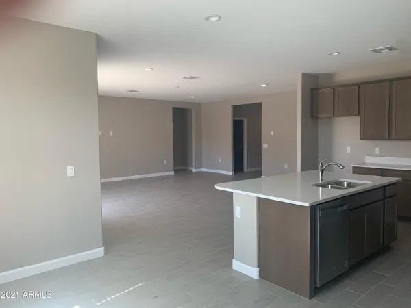 a kitchen with stainless steel appliances granite countertop a sink and a stove