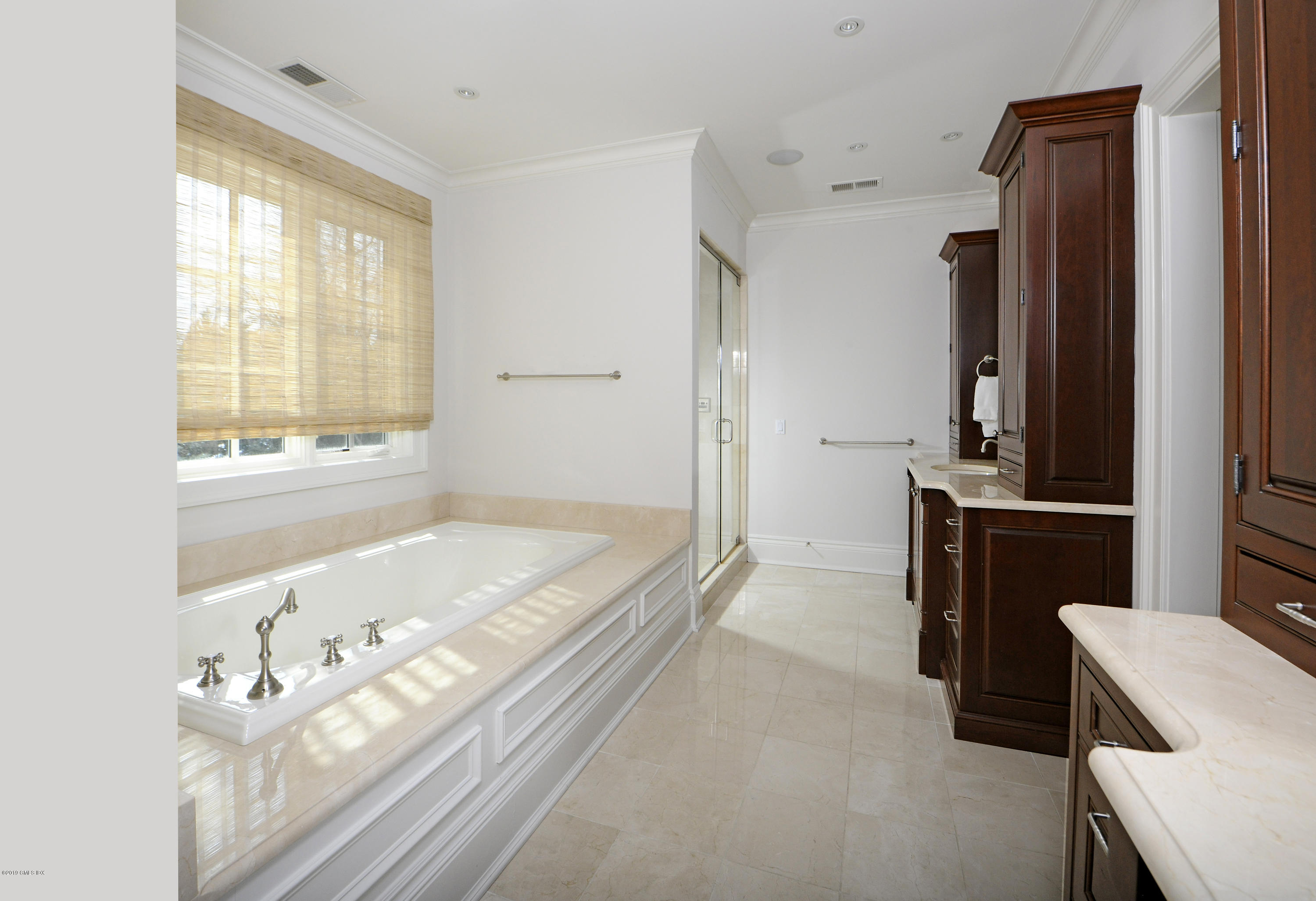 35 Beechcroft Road Greenwich, CT 06830 - Photo 11 of 21 a bathroom with a tub sink and mirror