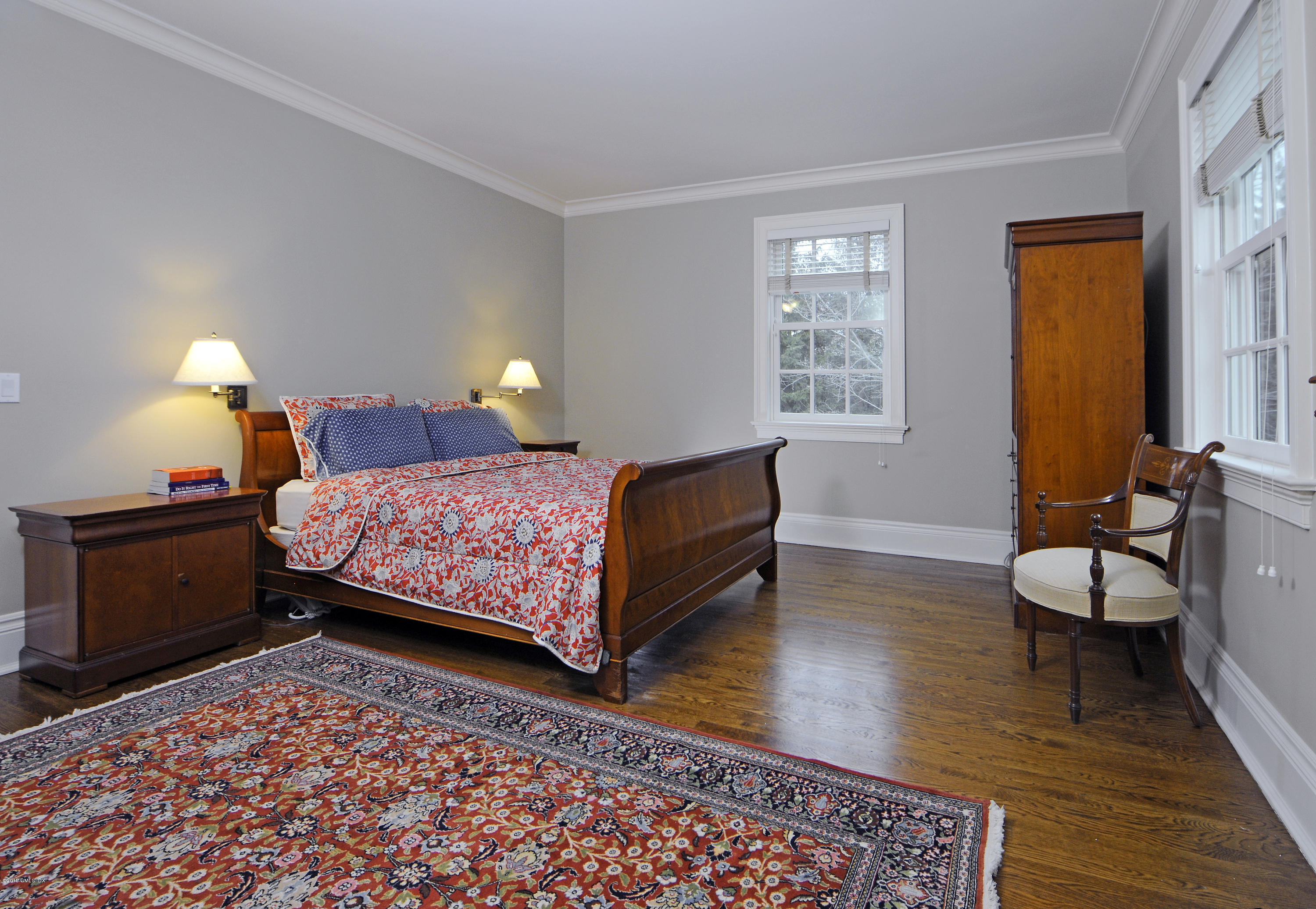 35 Beechcroft Road Greenwich, CT 06830 - Photo 14 of 21 a bedroom with a bed and wooden floor