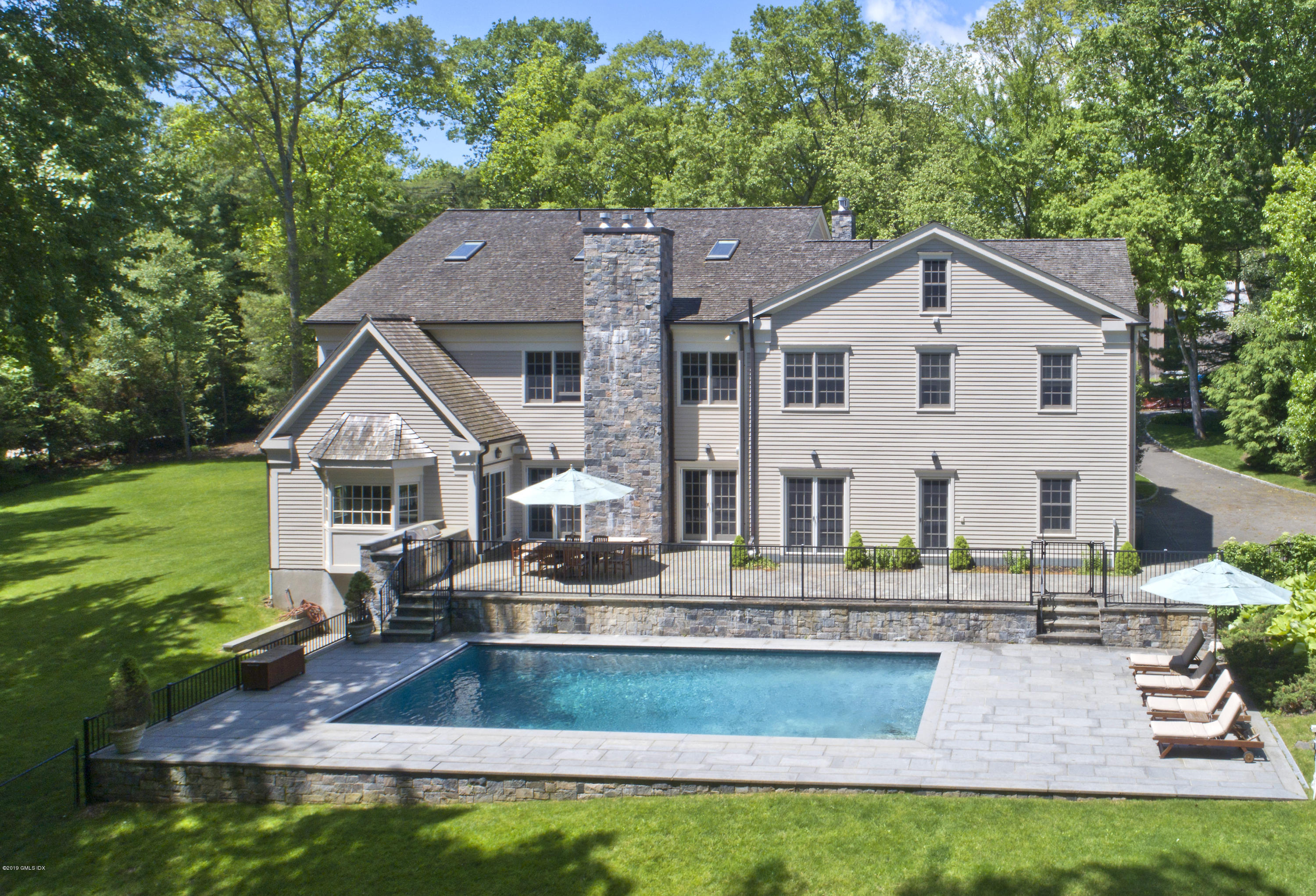 35 Beechcroft Road Greenwich, CT 06830 - Photo 19 of 21 a front view of a house with garden