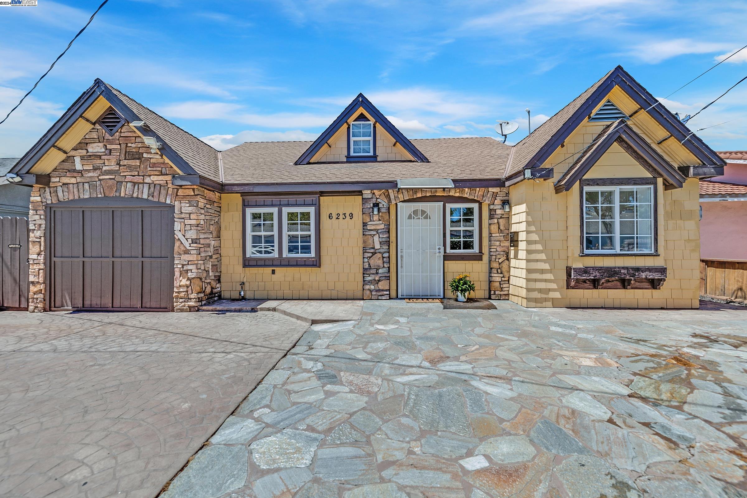 6239 Dairy Avenue Newark, CA 94560 - Photo 1 of 1 a front view of a house with a yard and garage
