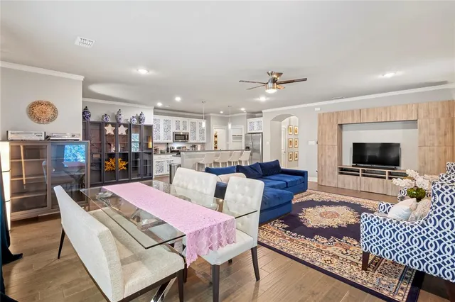 a living room with furniture kitchen view and a fireplace