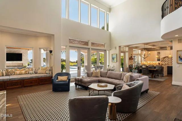 a dining hall with stainless steel appliances kitchen island granite countertop a sink and a granite counter tops