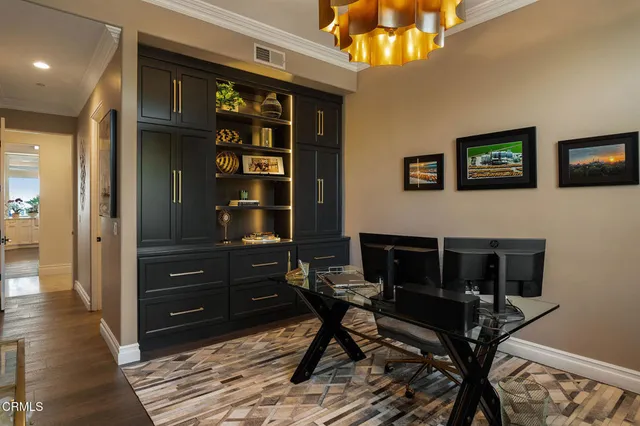 a bedroom with a balcony a bed and a flat screen tv