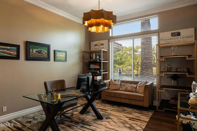 a bathroom with a window a sink and a mirror