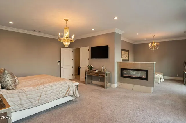 a spacious bathroom with a double vanity sink a mirror a bathtub and next to a window