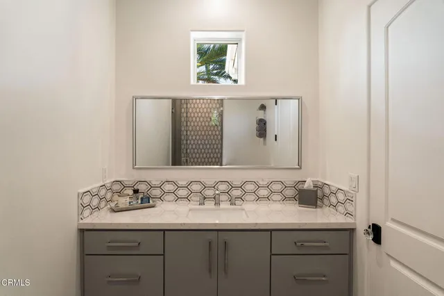 a bathroom with a shower toilet and sink