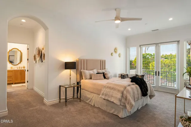 a front view of a house with swimming pool having outdoor seating