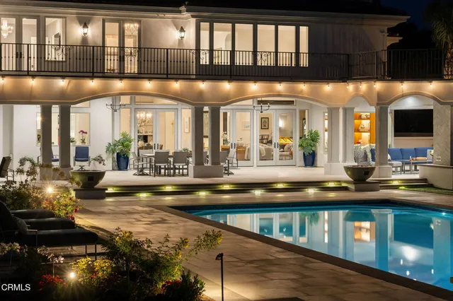 a front view of a house with trees