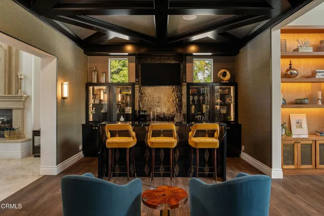 a view of a chairs and table in the patio