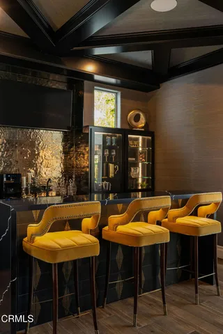 a room with furniture a flat screen tv and a fireplace