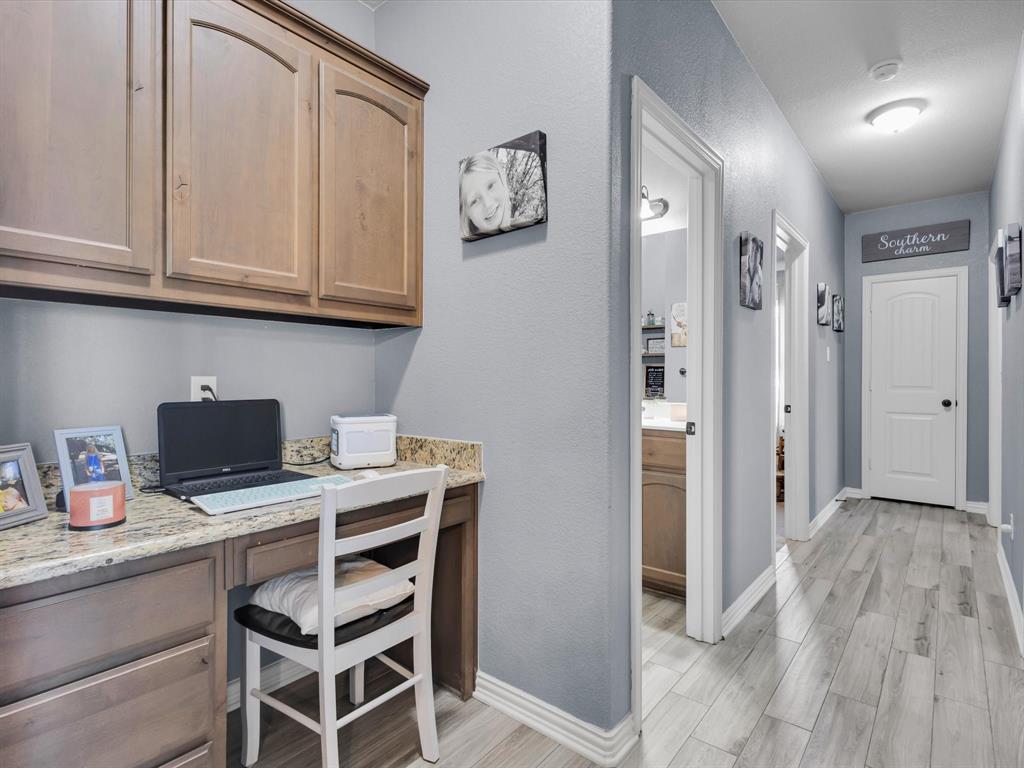 128 County Road 4430 Decatur, TX 76234 - Photo 21 of 34 a view of a kitchen with fridge and workspace