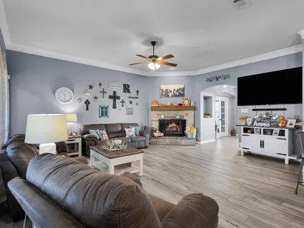 a living room with furniture and a flat screen tv