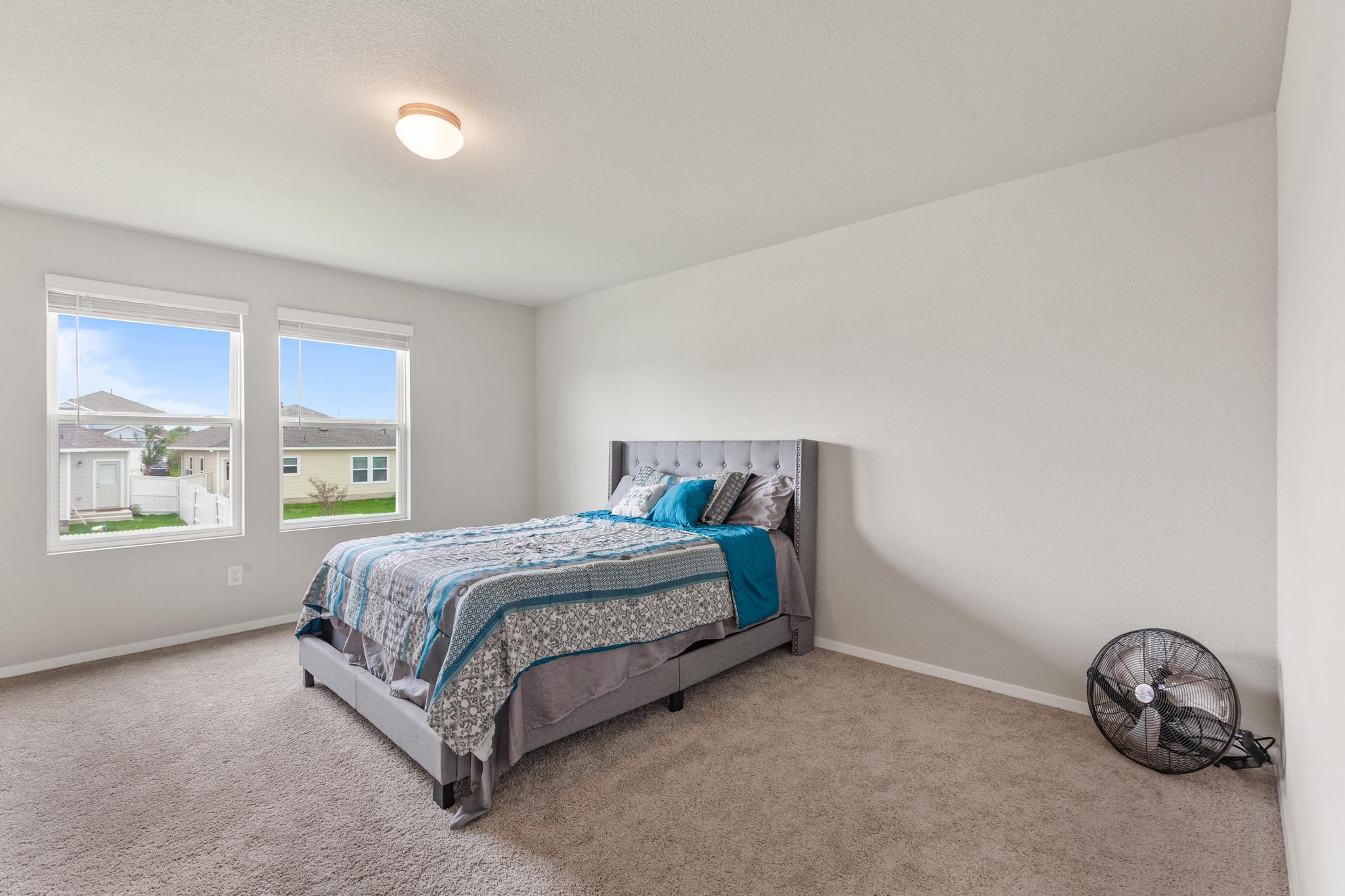 242 Barley Lane Elgin, TX 78621 - Photo 24 of 31 Spacious room featuring neutral carpeting and light gray wall paint