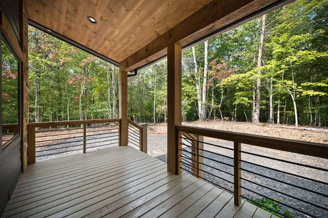 a large white kitchen with a large window