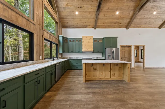 a kitchen with stainless steel appliances a refrigerator and a sink