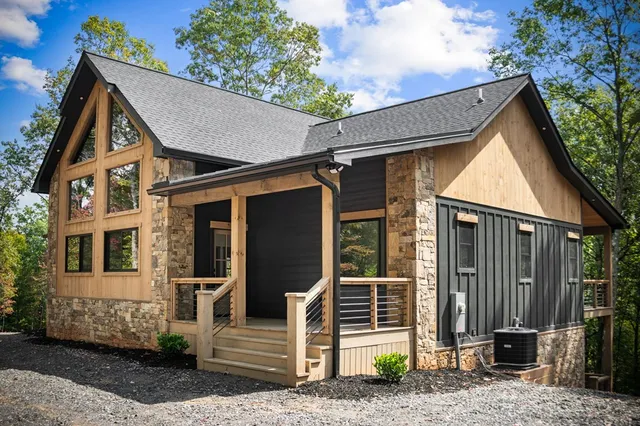 a view of a house with wooden fence