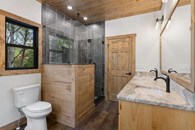 a bathroom with a double vanity sink and mirror