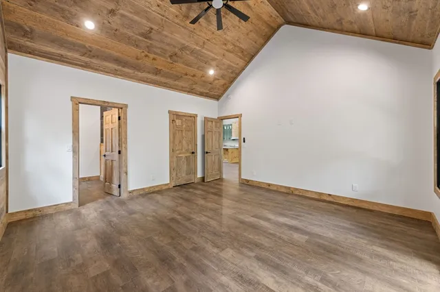 a bathroom with a granite countertop sink mirror and toilet