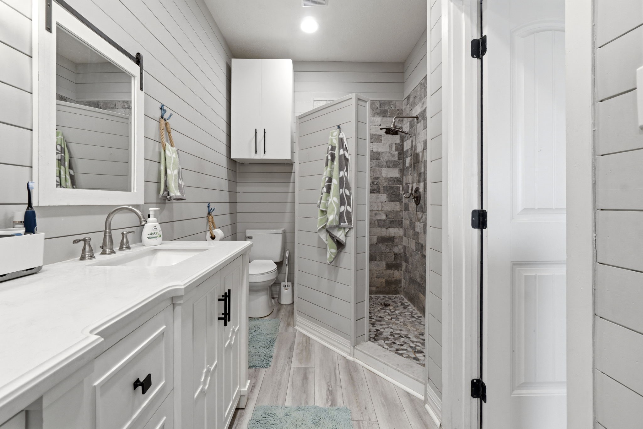 2 Key Harbour Conroe, TX 77356 - Photo 31 of 41 a bathroom with a shower sink and mirror