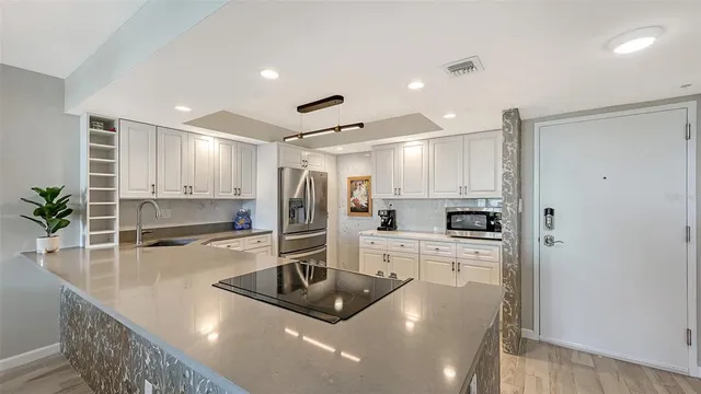 a kitchen with a stove and a sink