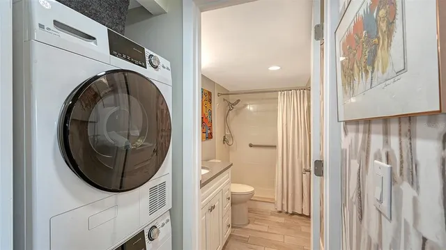 a view of a dining room with furniture wooden floor and chandelier