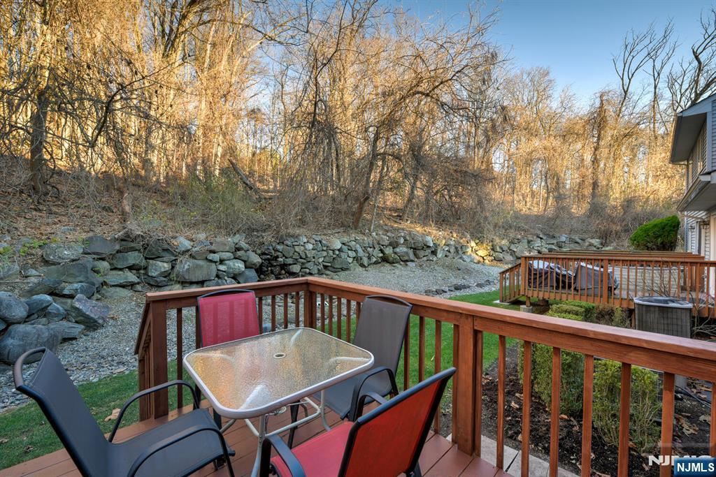 6 Hansen Place, Unit 6 Wayne, NJ 07470 - Photo 47 of 49 a view of a chairs and table on the deck