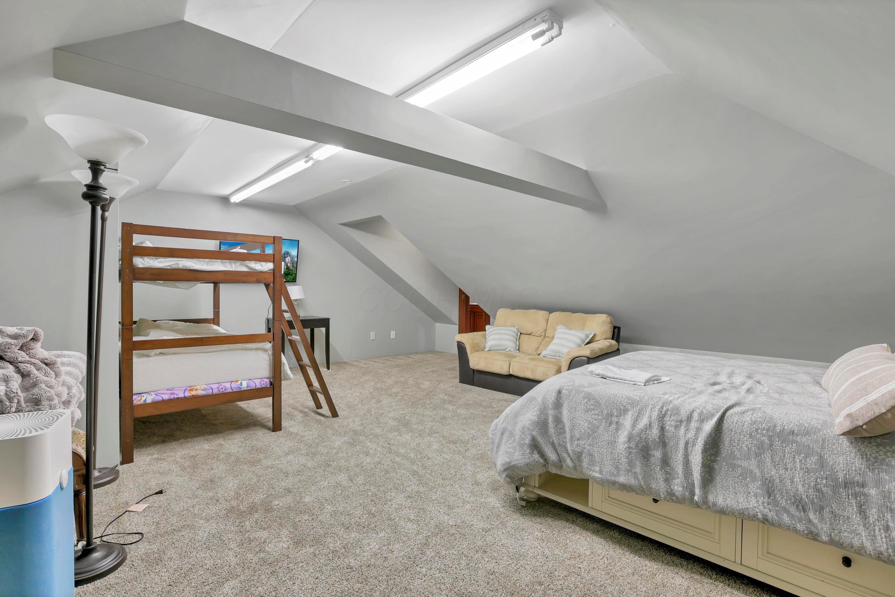 3575 State Rte 37 West Delaware, OH 43015 - Photo 69 of 106 Spacious room featuring sloped ceilings, light gray wall paint, and gray carpet flooring