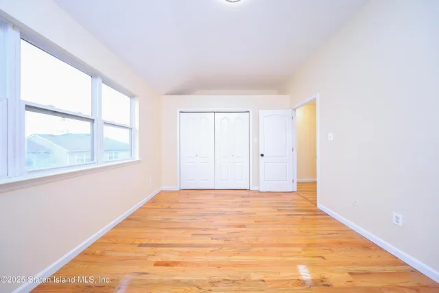 a view of an empty room and window