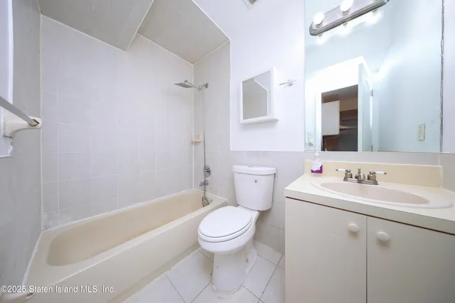 a bathroom with a toilet a sink and a bathtub