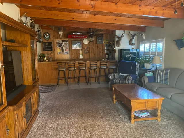 a view of a chairs and a room in a patio